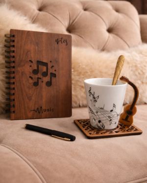 The Musical Journey – 1 Engraved Wooden Cover Spiral notebook Diary, 1 Black pen, 1 Ceramic music theme with guitar handle coffee Mug, 1 Wooden coaster, 1 Golden spoon.